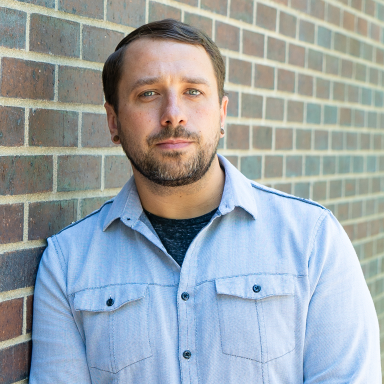 portrait of Josh Wells, who works in print shop production at marketing agency Elevation Ten Thousand in Latham, NY