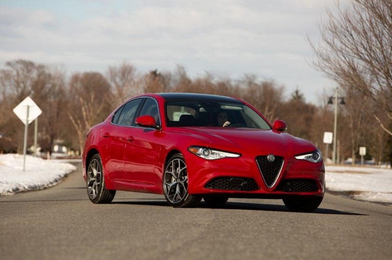 red 2019 Alfa Romeo Giulia Ti sportscar parked diagonally across a paved road