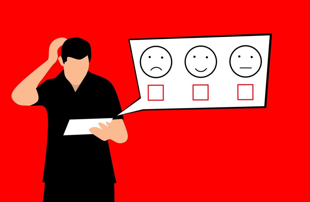 cartoon graphic of adult man holding a white tablet with a bubble showing happy and sad face ratings