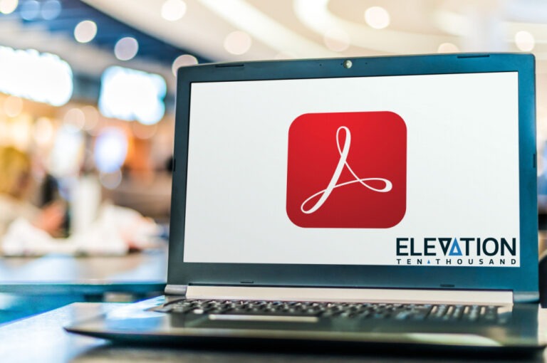 gray laptop opening the Adobe app to optimize a PDF