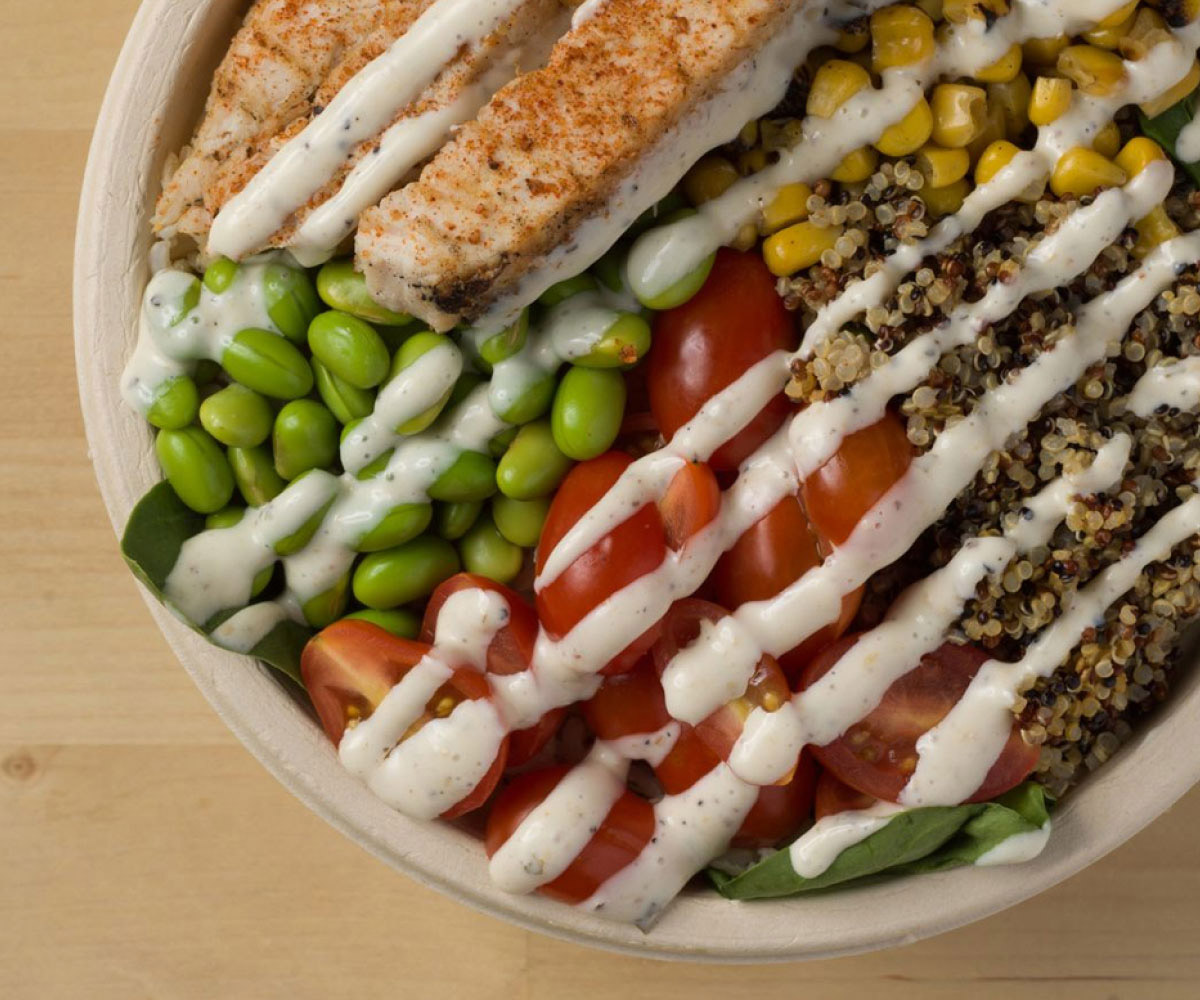 Bowled salad with dressing