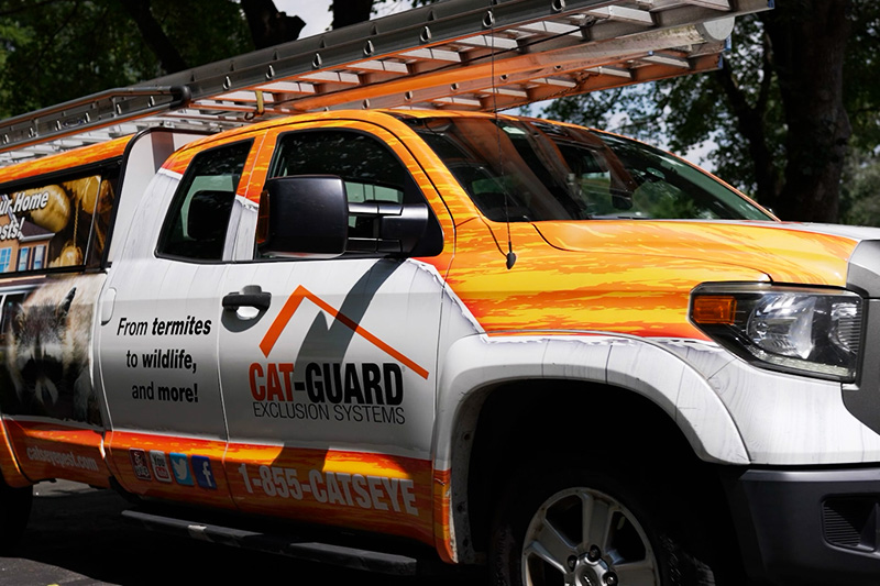 Catseye Pest Control truck in customers driveway.